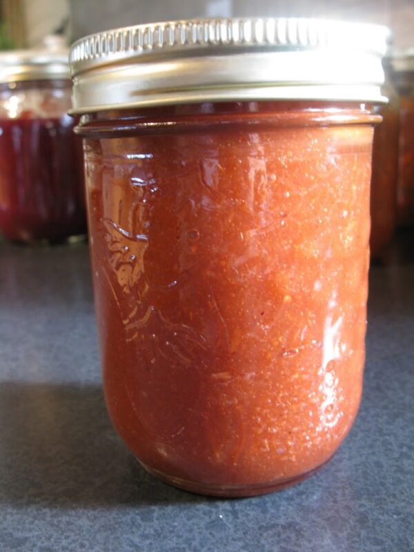 A mason jar with apple butter.