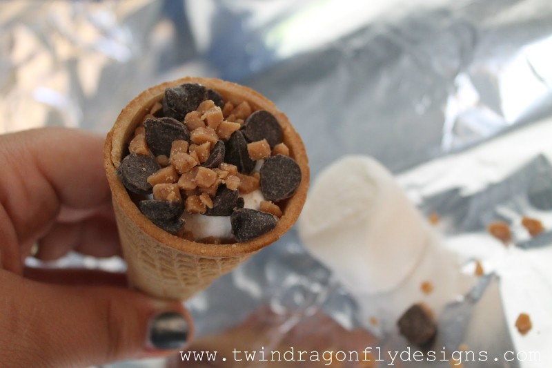 Campfire Cone filled with marshmallows, chocolate chips and skor bits.