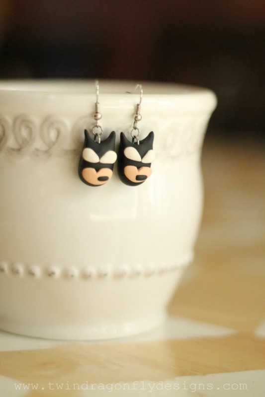 Clay earrings that look like batman.