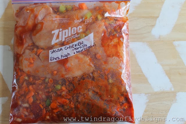 Freezer bag with ingredients for salsa chicken.
