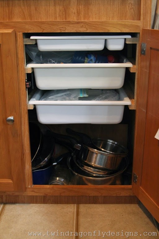 Travel Trailer Organization bins inside of cupboards.