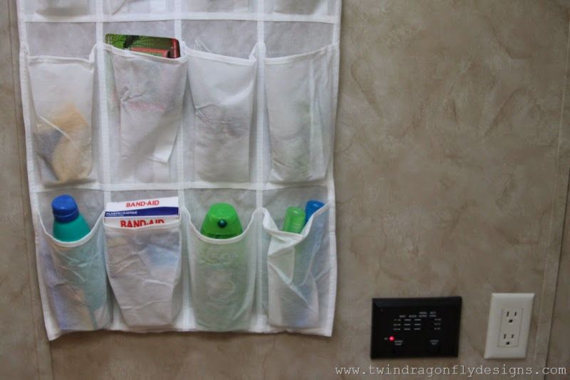 Travel Trailer shoe organizer hanging on the wall to store toiletries and first aid items.