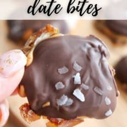 A hand holds a date bite covered in rich chocolate and sprinkled with sea salt. Text at the top reads 3-INGREDIENT date bites and at the bottom homemadeheather.com. Other delicious chocolate coconut date bars appear blurred in the background.