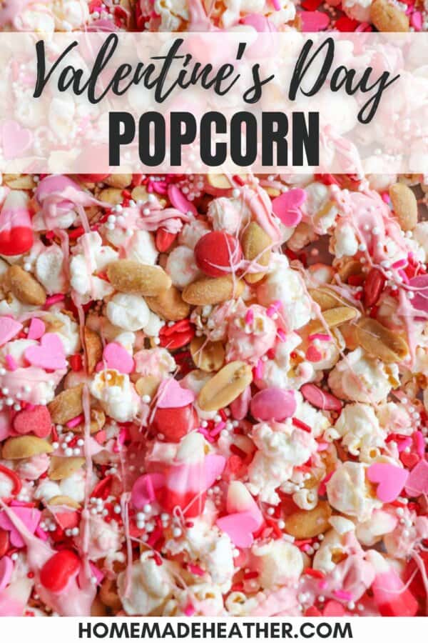A colorful mix of Valentines Day-themed popcorn featuring pink, red, and white candy coatings, heart-shaped sprinkles, peanuts, pretzels, and hints of chocolate coconut. Text overlay reads Valentines Day Popcorn.