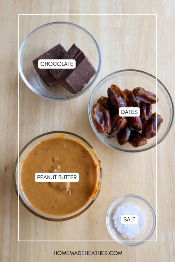 Top view of four glass bowls on a wooden surface containing ingredients: chocolate, dates, peanut butter mixed with chia seeds, and salt, perfect for creating delicious date bites.
