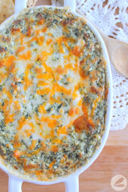 Baked spinach dip topped with cheese recipe.