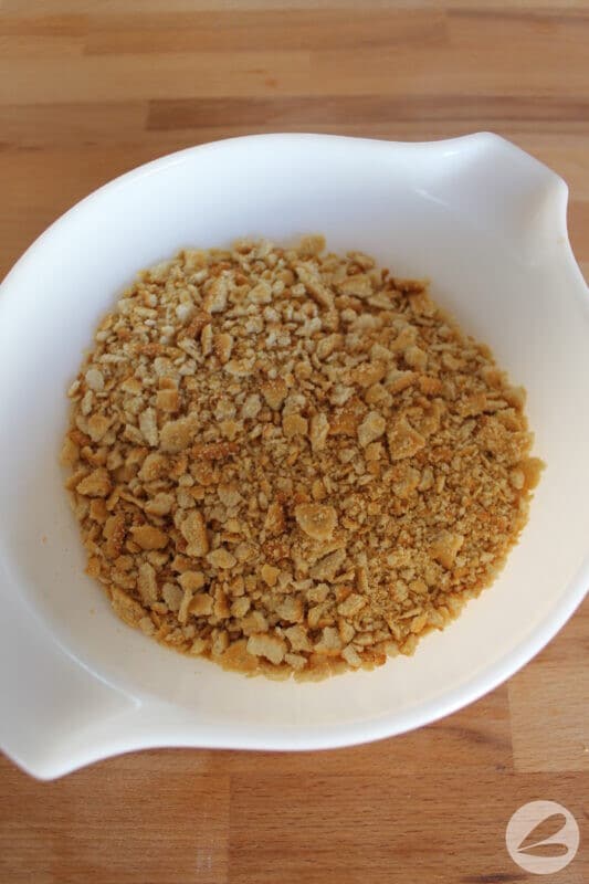 Ritz crackers crushed in a bowl.