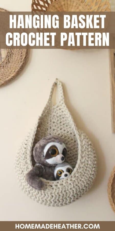 A free hanging crochet basket with small stuffed toys.