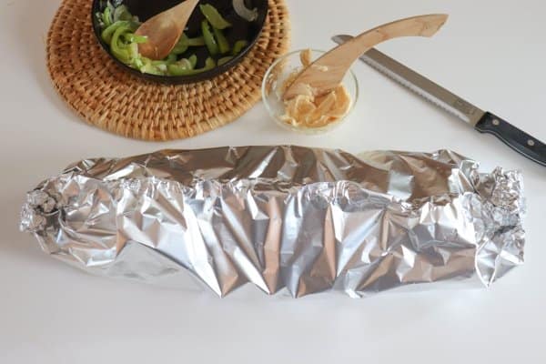 Campfire Philly Cheesecake Sandwich wrapped in a foil packet.
