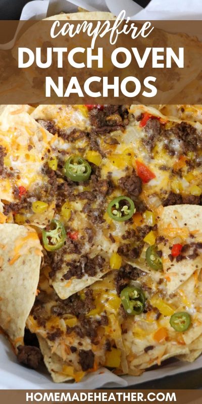 Nachos with ground beef, melted cheese and diced vegetables in a dutch oven with text overlay.