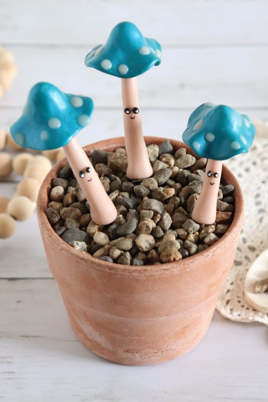 Polymer clay mushrooms in a terracotta pot.