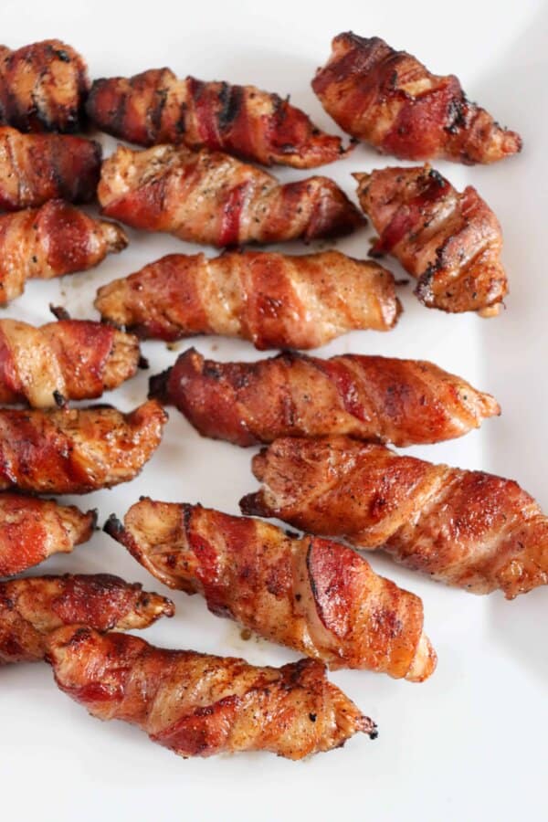 Grilled chicken tenders wrapped in bacon.