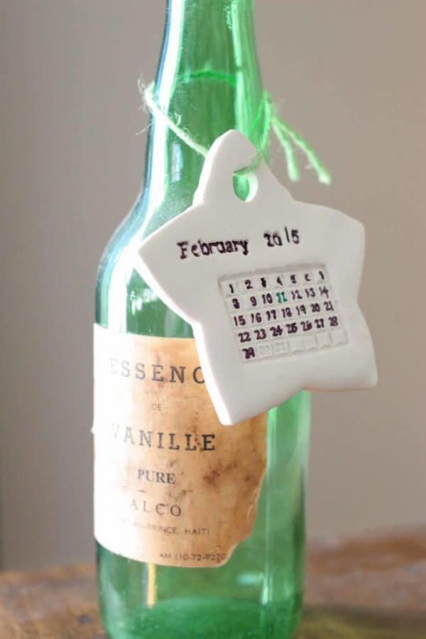 Star ornament with stamped calendar of Baby's birth month and day.