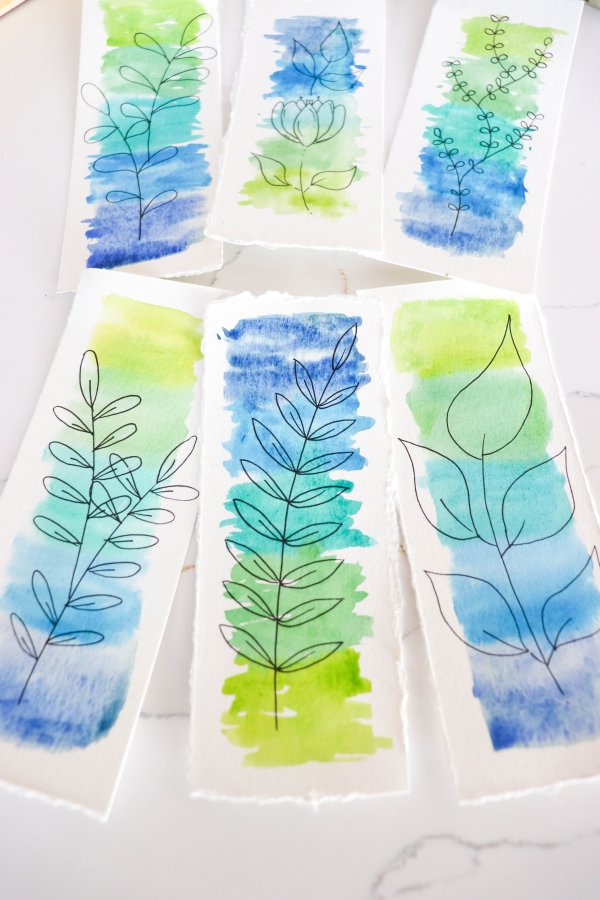Six watercolor bookmarks with leaf drawings.
