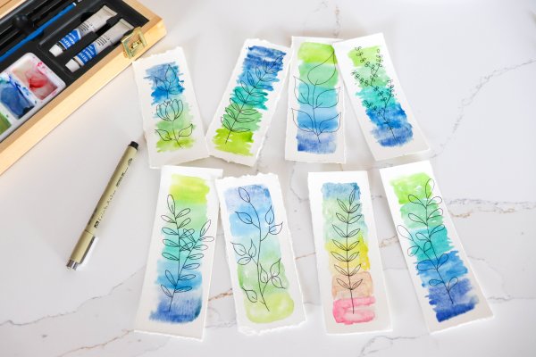 Eight watercolor bookmarks with leaf drawings.