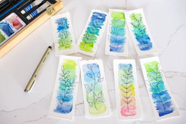 Eight watercolor bookmarks with leaf drawings.