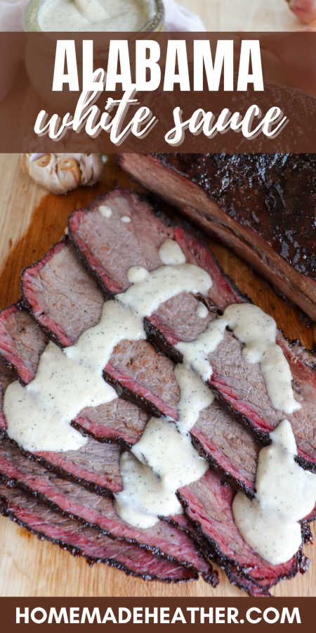 Alabama White Sauce drizzled on slices of smoked brisket.