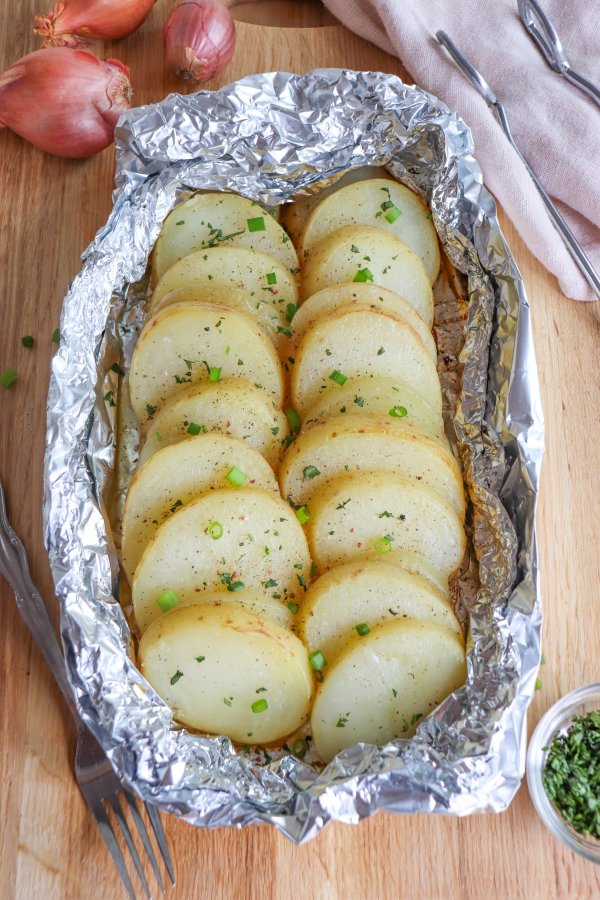 Potato and onion in foil packs.