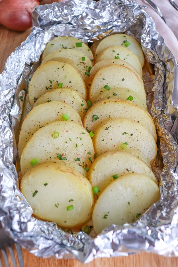 Potato and onion in foil packs.