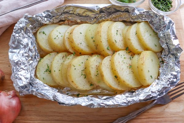 Potato and onion in foil packs.