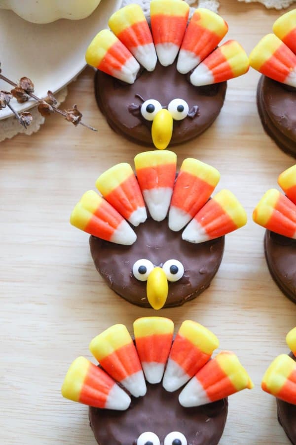 Nutter Butter Turkey Cookies with candy corn feathers and candy eyes.