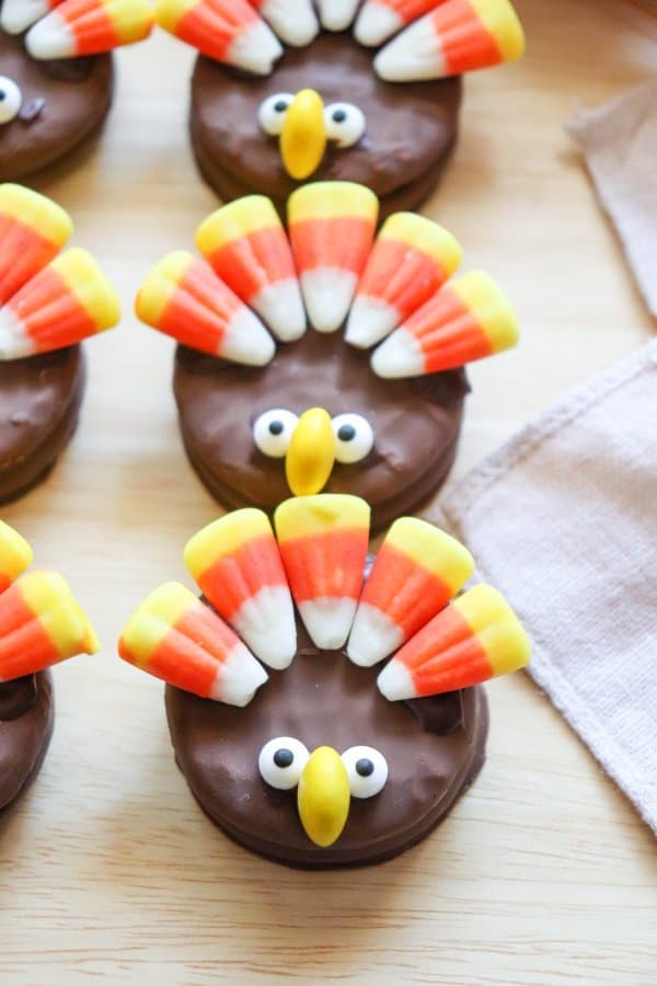 Nutter Butter Turkey Cookies with candy corn feathers and candy eyes.