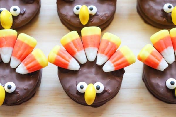 Nutter Butter Turkey Cookies with candy corn feathers and candy eyes.