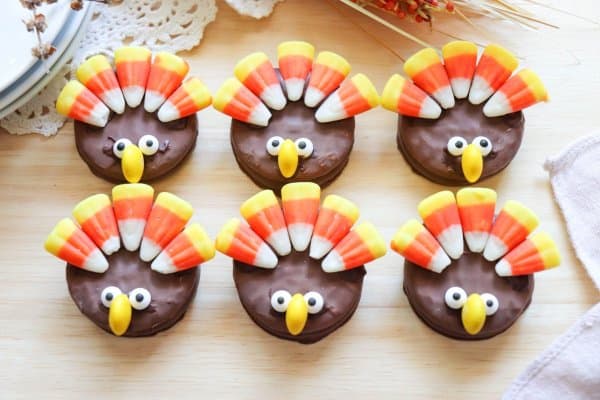 Nutter Butter Turkey Cookies with candy corn feathers and candy eyes.