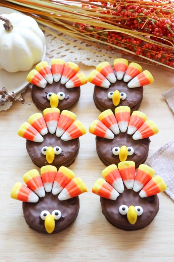 Nutter Butter Turkey Cookies with candy corn feathers and candy eyes.