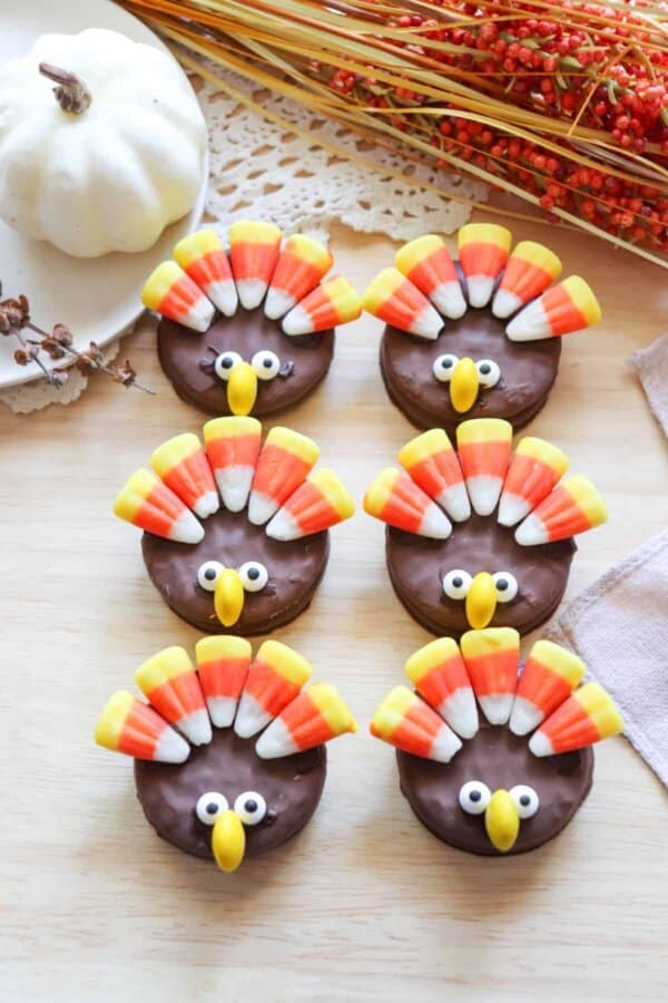 Nutter Butter Turkey Cookies with candy corn feathers and candy eyes.