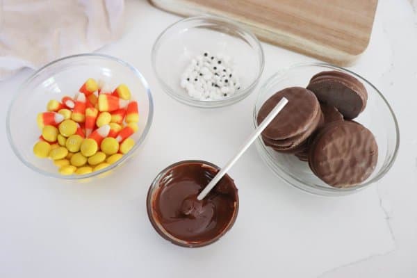 Nutter Butter Turkey Cookie Process of melted chocolate in a clear glass bowl.