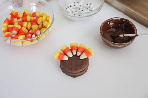 Nutter Butter cookie with candy corn stuck on top.
