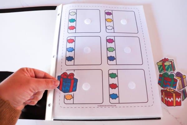 Christmas Quiet Book Printable Process on a white counter.