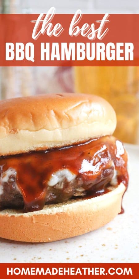 The Best BBQ Hamburger Recipe close up of a burger covered in melted cheese and barbecue sauce.