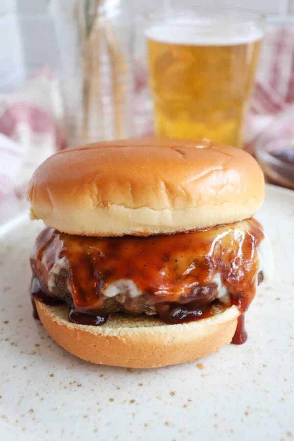 Best BBQ Hamburger covered in melted cheese and barbecue sauce.