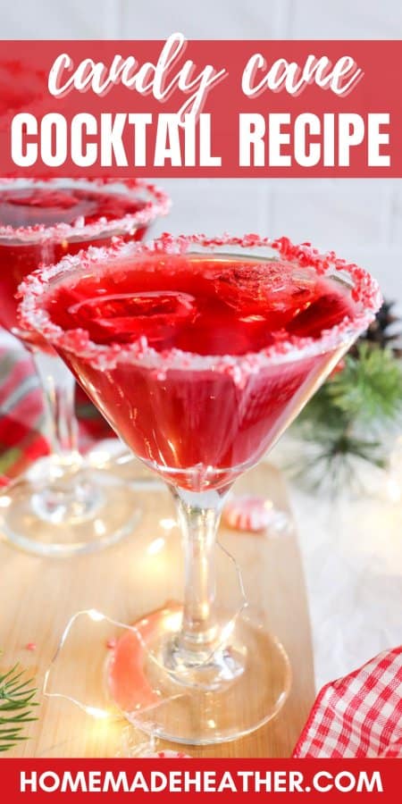 Red drink in a cocktail glass with candy cane garnish and ice with text overlay.