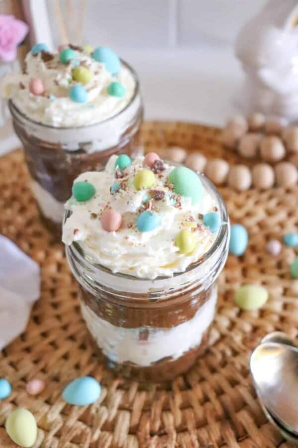 Mini Egg Easter Parfait in a jar with whipped cream topping.