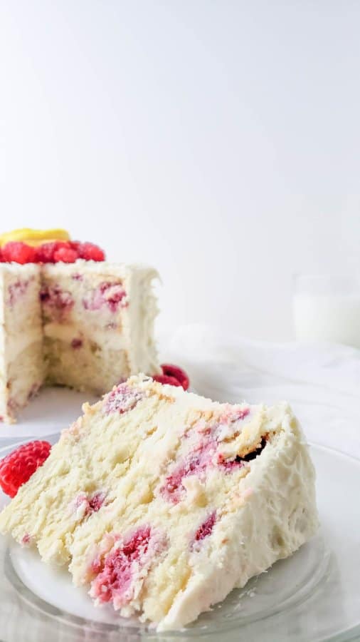 A close up of a slice of raspberry cake to show the cake's texture.