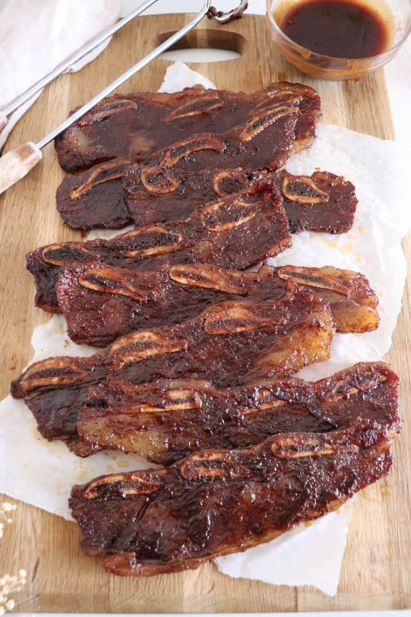 Smoked short ribs on a board before serving.