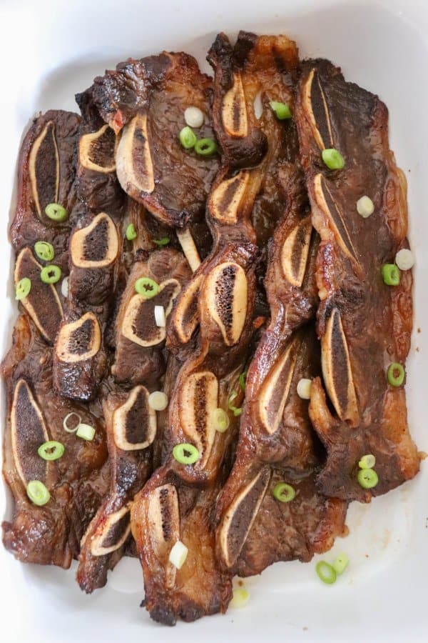Baked beef short ribs with garnish.