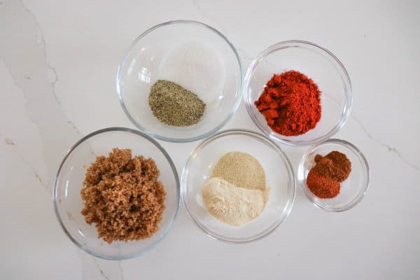 Individual bowls of short ribs dry rub recipe ingredients.