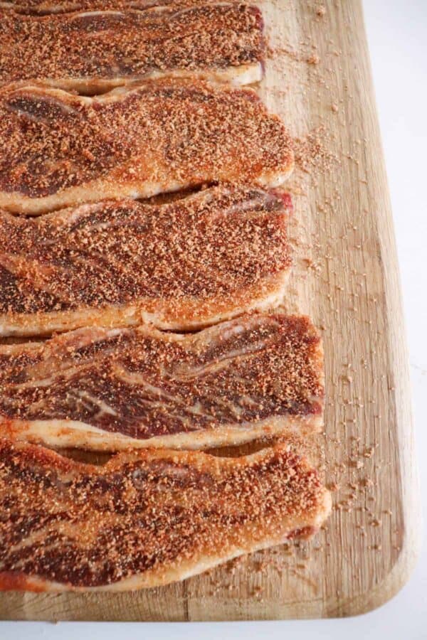 Short ribs with the dry rub recipe on a cutting board.