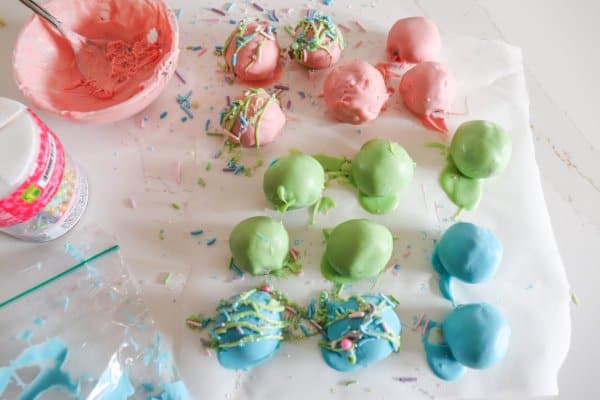 Easter Oreo Cake Ball Process with a bowl of melted chocolate.