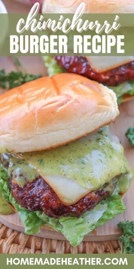 Smoked burger topped with melty gouda cheese and chimichurri sauce on a bed of lettuce on a wooden cutting board with a text overlay.
