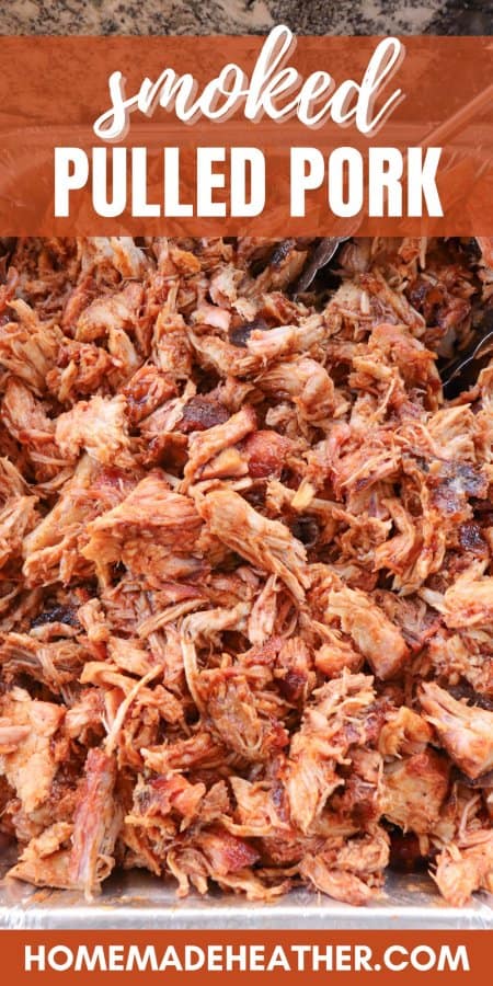 Smoked Pulled Pork close up in an aluminum tray covered in bbq sauce.