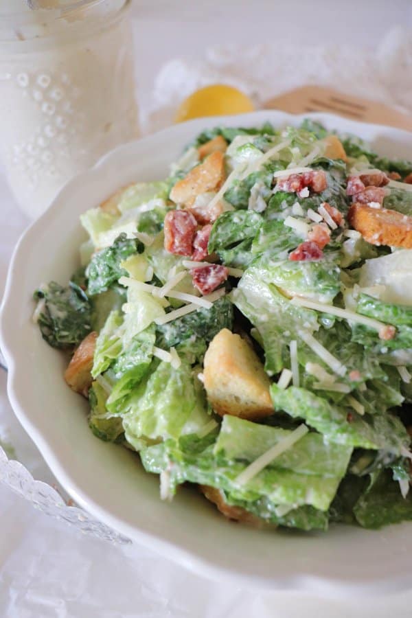 Caesar salad with croutons, bacon bits, and parmesan cheese.