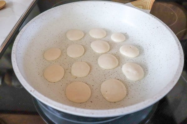 Mini drops of batter on frying pan
