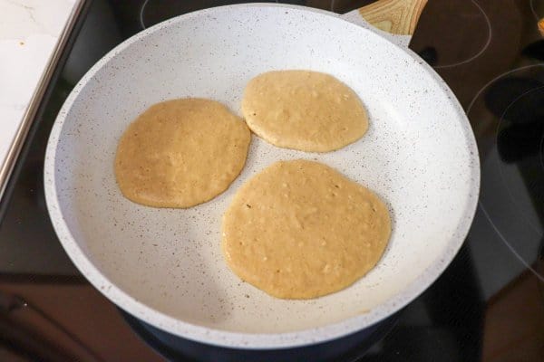 apple pancake batter in skillet