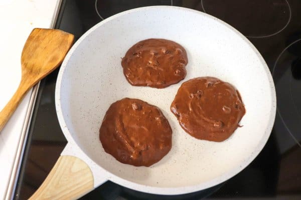 chocolate pancake batter on skillet