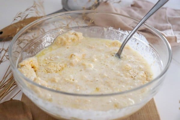 Cornmeal pancakes wet and dry ingredients being mixed together.